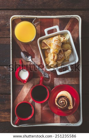 Breakfast set up in tray from above on wooden background