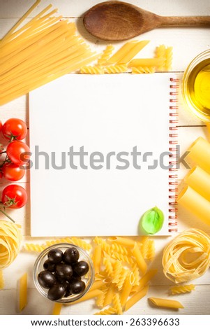 Blank cooking book with white background and ingredients all around