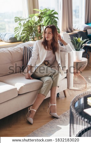 Similar – Image, Stock Photo Stylish relaxed woman on chair at home