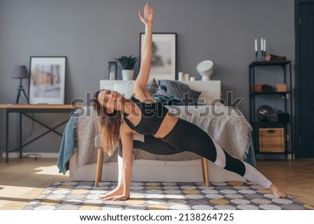 Similar – Foto Bild Flexible Sportlerin streckt Körper auf sonnigen Tal