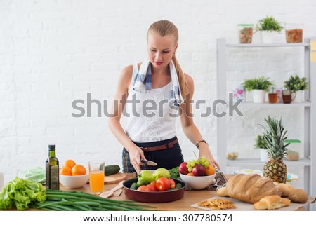 Woman preparing dinner in a kitchen concept cooking, culinary, healthy lifestyle