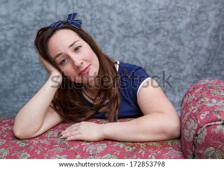 horizontal orientation close up of a young woman in business attire looking completely bored and anxious / Is it Friday Yet?