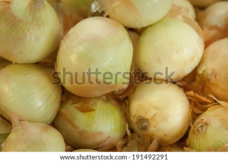 horizontal orientation close up of yellow onions, with copy space provided / Horizontal Yellow Onions