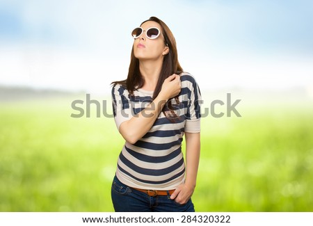 Beautiful woman with white sunglasses. Over nature bokeh background