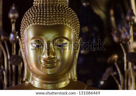 Golden Buddha Image  in Ancient Buddhist temple (Wat Pra-Singh) Chiangmai, Thailand.