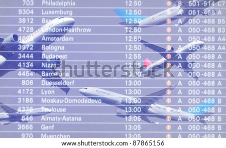 Passenger plane in flight and flight information board