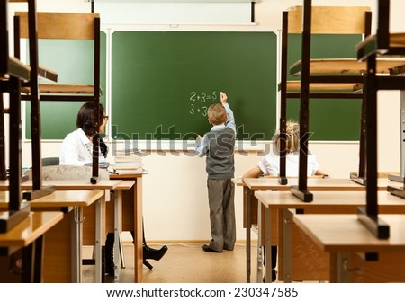 School children are learning in the half empty classroom during epidemic of flu.