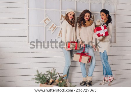 Three beautiful girls with gifts