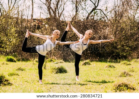 Two twin sisters involved in gymnastics