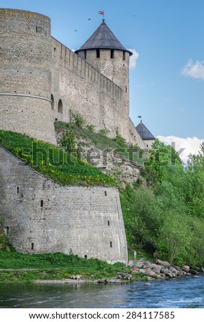 Ivangorod fortress on the banks of the Narva River. Border post Russian border guard and dog