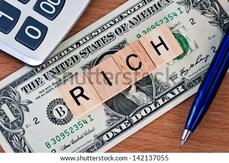 The letters RICH on  dollar banknote business concept