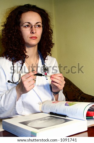 Young Lady doctor with syringe & stethoscope