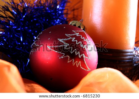 Winter ornaments: ball and candle