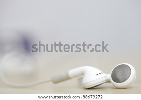 Modern and small earphones on a desk