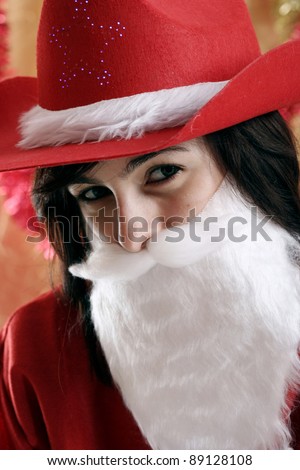 Beautiful woman dressed in santa clause costume.