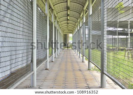 Walk path with cage and iron roof in horizontal view