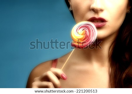 Sexy Girl Licks Lollipop On Blue Background Stock Photo 221200513 ...