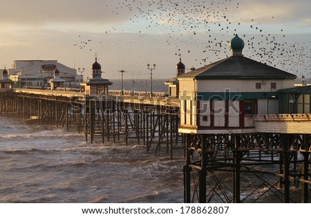 BLACKPOOL, UK- FEBRUARY 23rd 2014.TheNorth Pier at dusk along Blackpool\'s famous Golden Mile,  the first pier to appear in 1863  and still offers  hours of entertainment  thousands of visitors a year