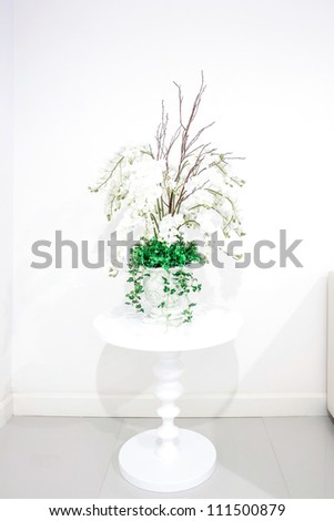 White vase and flowers on white background
