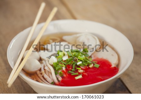 Pork meatballs and steam fish in noodle soup
