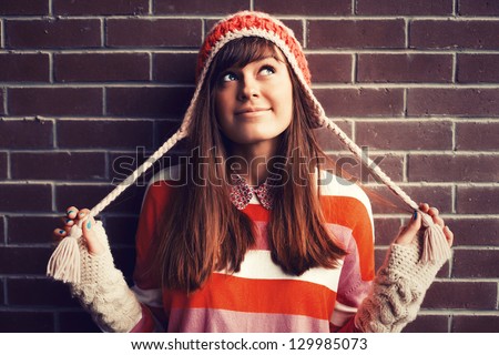 Image, Stock Photo Cute modern teen girl in a green jacket and orange hat walks with her dog in nature. Pet, care, friendship.