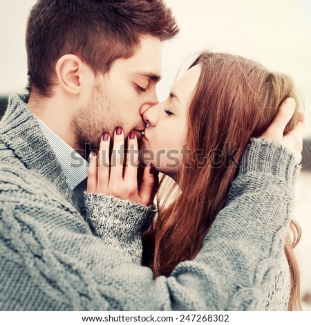 Closeup colorful stylish sensual portrait of young beautiful couple in love kissing and happy together