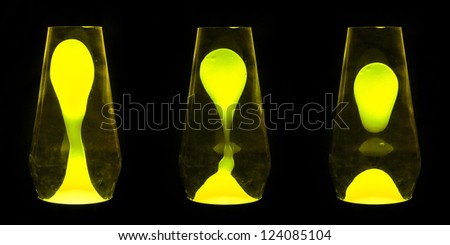 Three lava lamps showing progress of the Yellow wax going up and separating