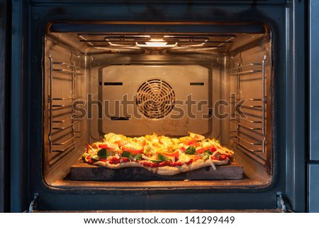 Cooking pizza in hot air oven