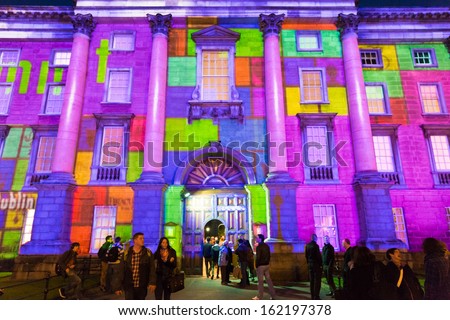 DUBLIN - OCTOBER 30: Failte Ireland works with Trinity College and the IDA to develop high impact light projections on the facade of Trinity College and Bank of Ireland on October 30, 2013 in Dublin