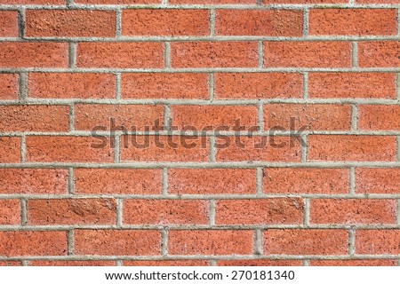 Red brick wall made of red bricks and mortar