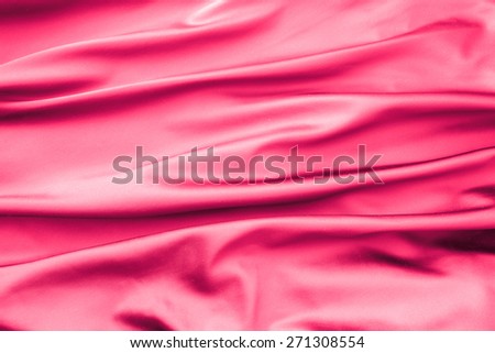Soft velvet piece of pink fabric with folds to be used as background