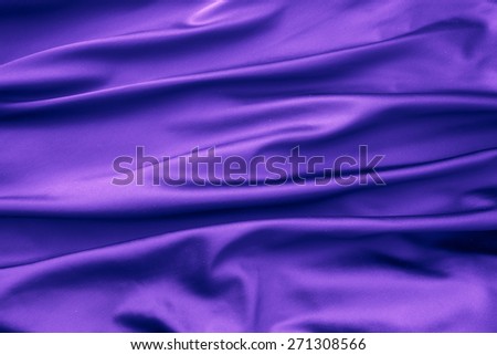 Soft velvet piece of purple fabric with folds to be used as background