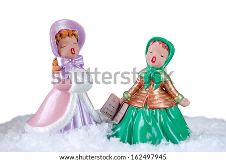 christmas image of two beautiful vintage carol singers over white background