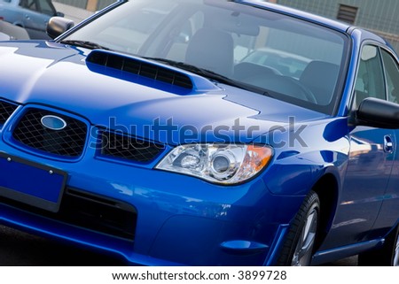 New Subaru sitting in a car lot waiting to be sold
