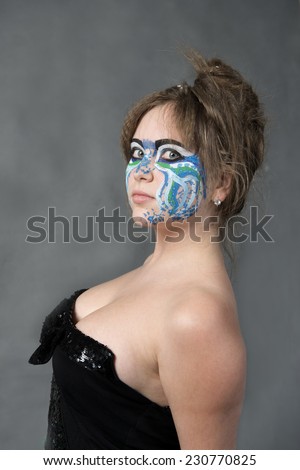 Art body art unusual make-up on her face