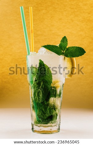 Mojito, glass of water with lemon, ice and mint