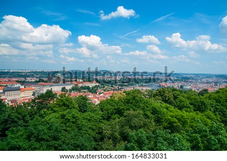 Landscape of Prague city center through the trees, aerial view