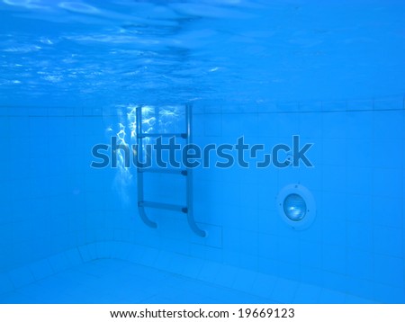 Underwater picture of a swimming pool; concept of isolation, fear and other feelings.