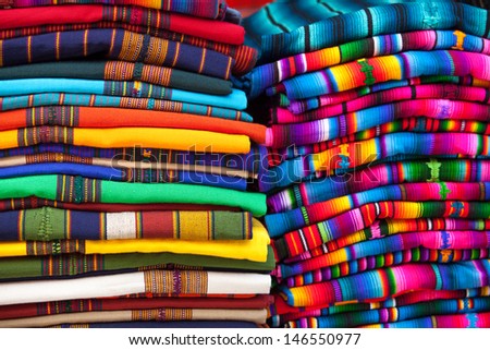 Colorful Mexican blankets for sale at market, Latin America. Mexico travel background.