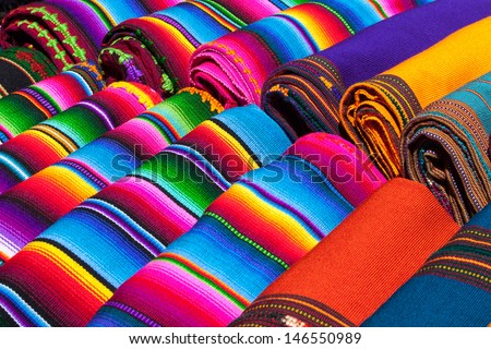 Colorful Mexican blankets for sale at market, Latin America. Mexico travel background.