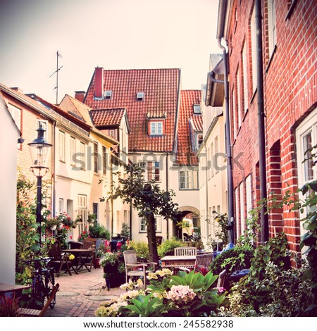 Luebeck backyard area with its typical houses in the retro style and toning filter instagram
