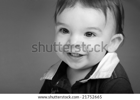 Portrait of an adorable little boy with big eyes. In black and white.