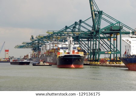 ANTWERP, BELGIUM - AUGUST 8: Loading and unloading of container-ships August 8, 2010 in Antwerp, Belgium. MSC Home terminal, one of the biggest terminals in the port