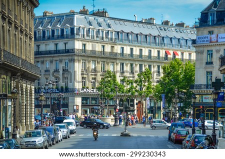 PARIS, FRANCE - MAY 29, 2011: Tourists gather at the intersection of Rue de la Paix and Rue des Capucines. Some of the most luxurious shops in Paris are located in this neighborhood.