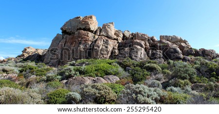 Panoramic scenic view  of the  landscape  where the ocean splashes  on the gneiss sedimentary rock formations at Canal rocks  on the south west coast of Western Australia  on a fine day in autumn.
