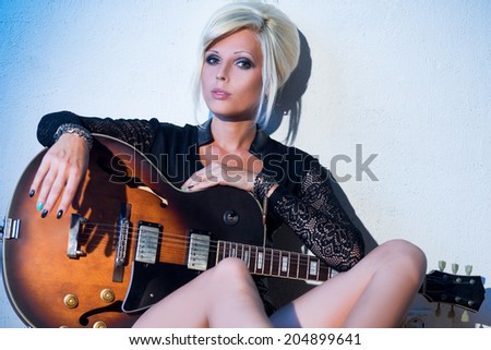 Blonde girl with guitar