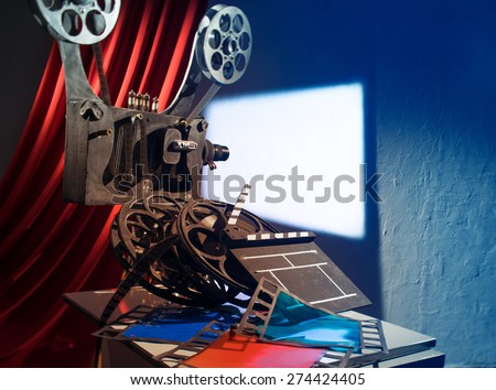 Film projector projecting a movie on the wall