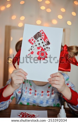 child girl with christmas handmade post card