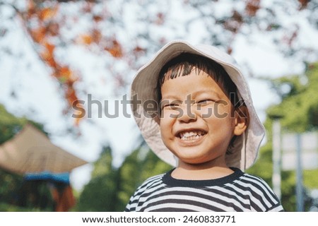 Similar – Image, Stock Photo child wearing a hat and glasses smiling at the camera