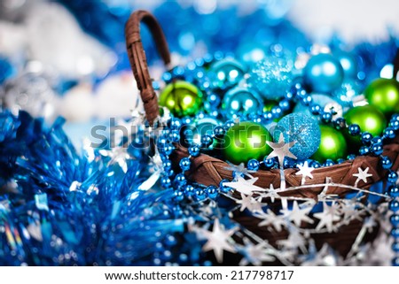 Christmas card with blue balls. Blurred image of xmas decoration. Selective focus.